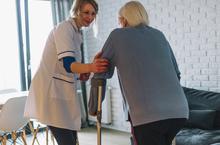 woman-walking-with-nurse-retirement-home